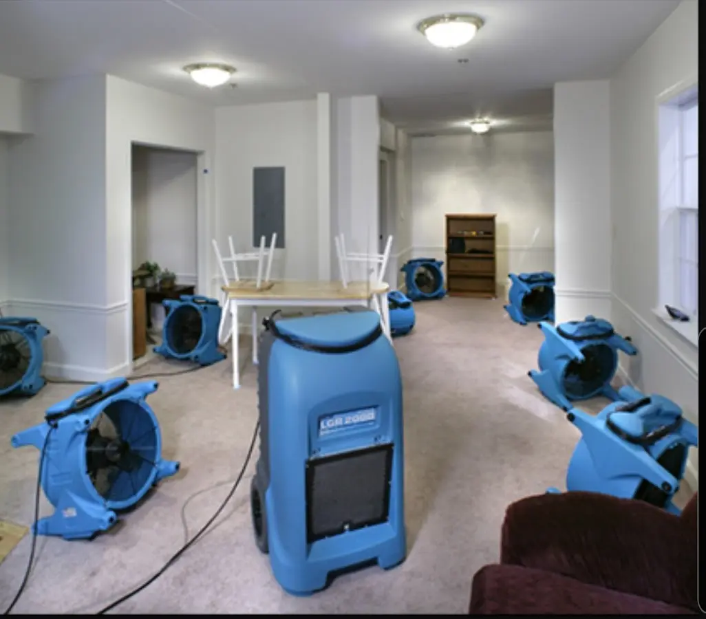 Air movers and dehumidifier setup for Water Damage Restoration in Plover